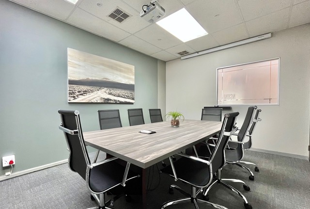 Conference room with table and presentation equipment