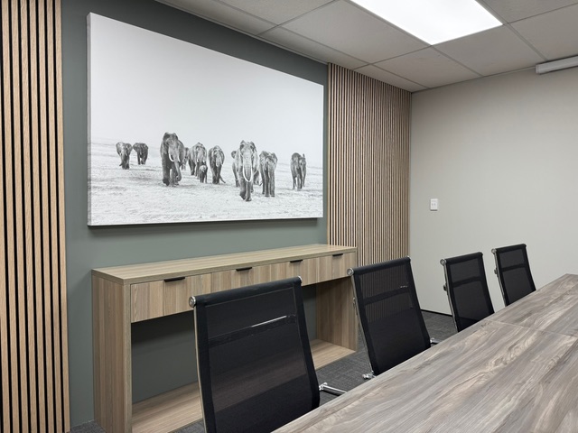 Meeting room with elephant artwork and wood-panelled walls