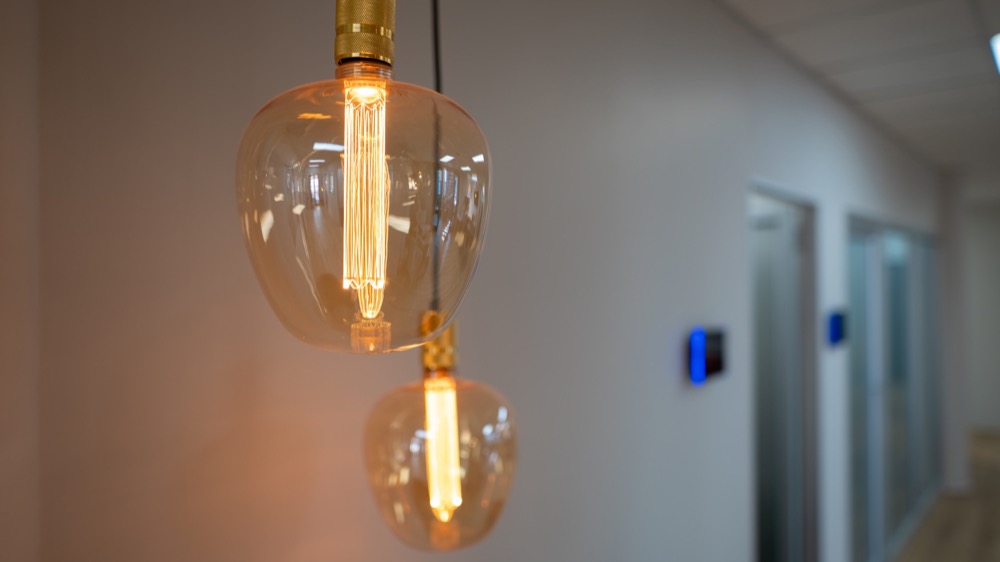 Glass pendant lights along the office corridor